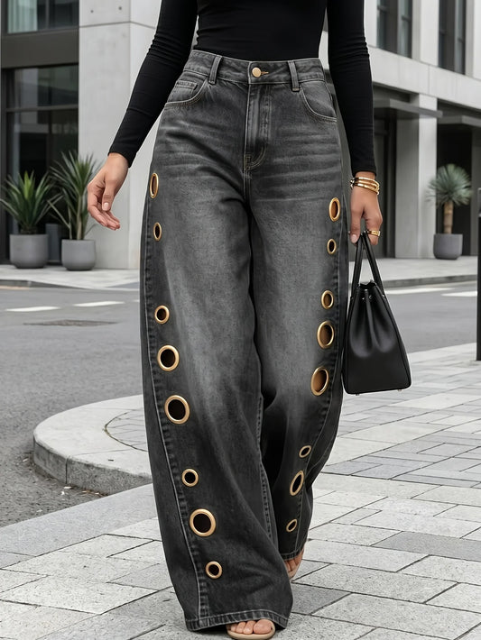 Retro-style wide-leg jeans with metallic eyelets, high-waisted, loose, floor-length fit, gradient eyelets of varying sizes on both sides, distressed washed finish, classic front and back pockets, perfect for everyday casual w